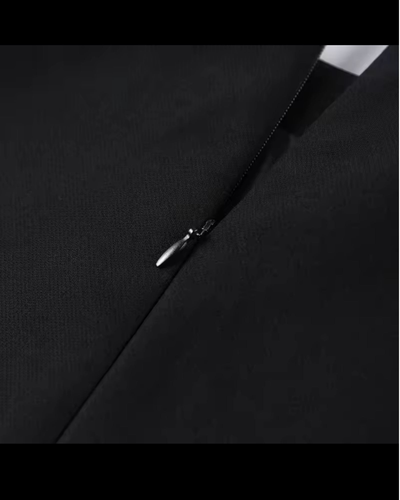 Back zipper detail of black structured shoulder cape top - minimalist luxury womens fashion 